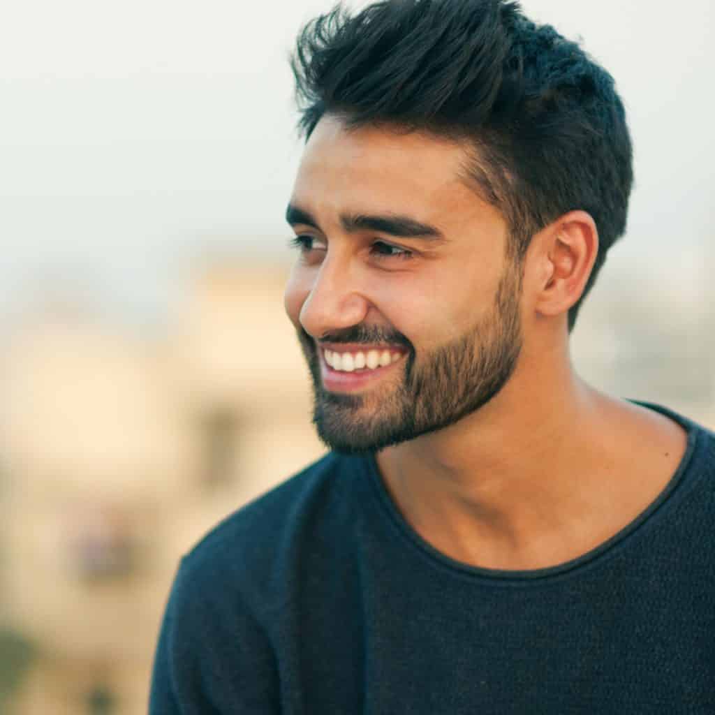 Ramadan oral health portrait of bearded man smiling